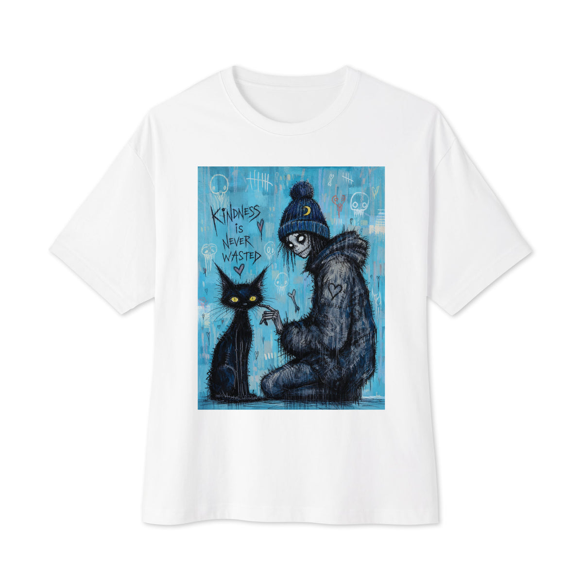 White oversized boxy tee with the 'Kindness Is Never Wasted' goth graphic: a girl in a moon beanie petting a black cat on a blue background, with the words "Kindness is never wasted"