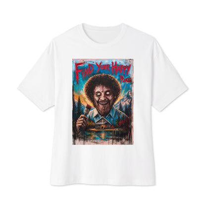 White oversized boxy tee with the 'Find Your Happy Place' goth graphic: a zombie painter with a curly afro holding a paintbrush in front of a lakeside cabin, with the words "Find your happy place"