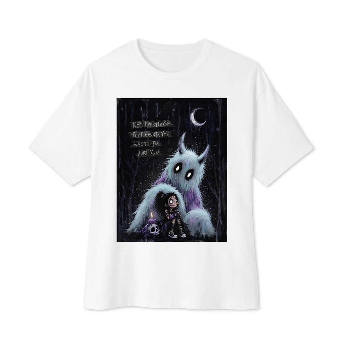 White oversized boxy tee with the 'The Haunted' goth graphic: a little goth girl holding a candle beside a fuzzy blue monster under a crescent moon, with the words "Not everything that haunts you wants to hurt you"