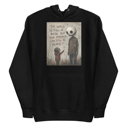 Black pullover hoodie with the 'Stay Kind' goth graphic: a tall skull-faced figure and a small child holding a flower, with the words "The world is full of noise, but your kindness can still be heard"