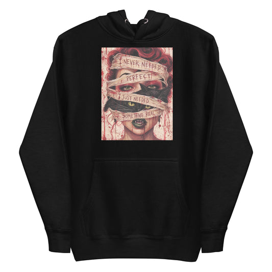 Black pullover hoodie with the 'Just Something Real' goth graphic: a red-haired woman's face wrapped in bandages, with the words "I never needed perfect, I just needed something real"