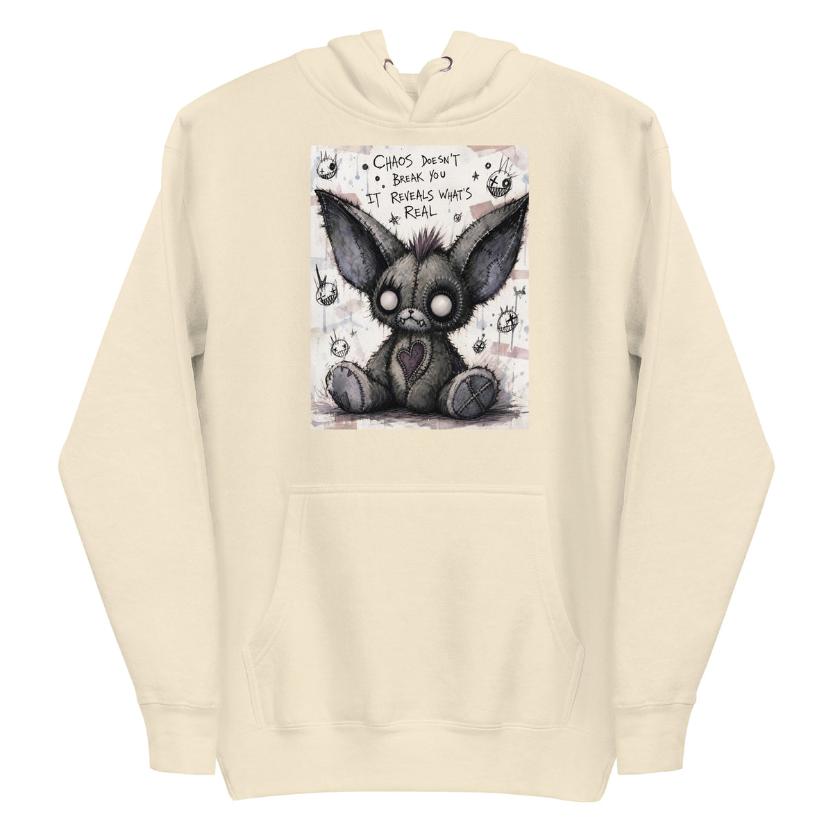 Bone pullover hoodie with the 'Chaos' goth graphic: a stitched gray big-eared creature with button eyes, with the words "Chaos doesn't break you, it reveals what's real"