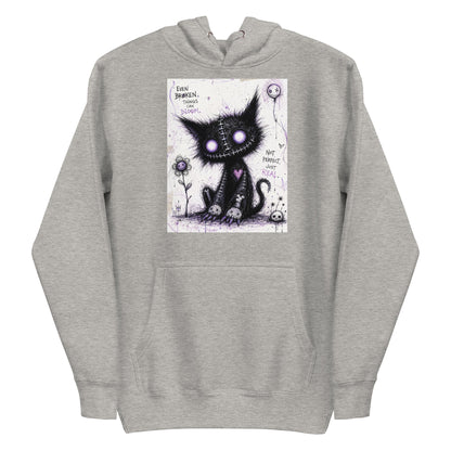 Carbon grey pullover hoodie with the 'Even Broken Things Can Bloom' goth graphic: a stitched black cat with glowing purple eyes beside a flower, with the words "Even broken things can bloom"
