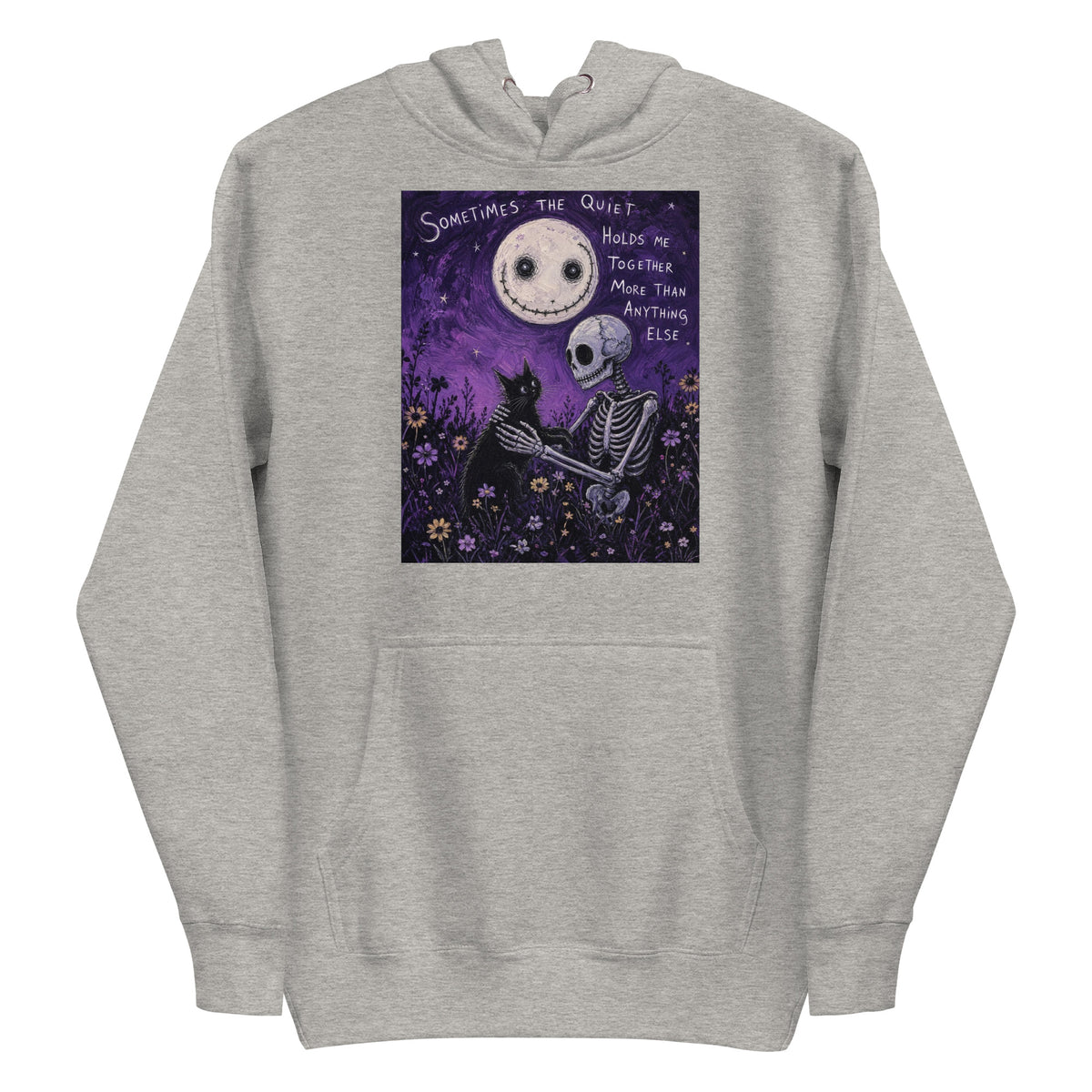 Carbon grey pullover hoodie with the 'The Quiet Heals' goth graphic: a skeleton and a black cat in a purple flower field under a smiling moon, with the words "Sometimes the quiet holds me together more than anything else"
