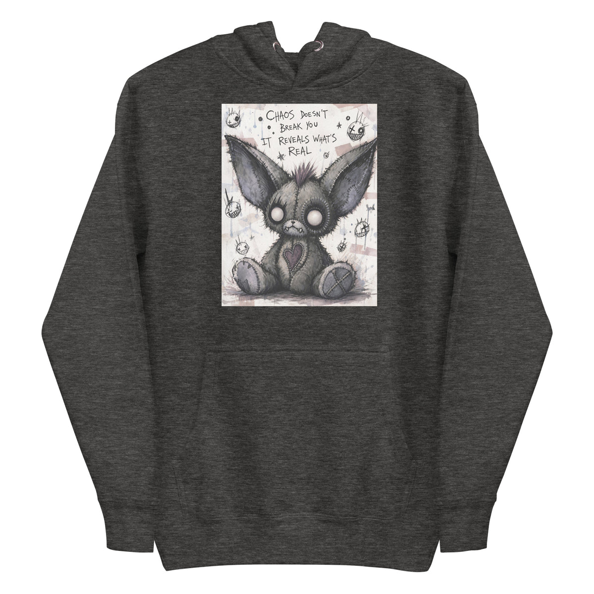 Charcoal heather pullover hoodie with the 'Chaos' goth graphic: a stitched gray big-eared creature with button eyes, with the words "Chaos doesn't break you, it reveals what's real"