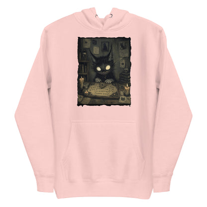 Light pink pullover hoodie with the 'Free Readings' goth graphic: a wide-eyed black cat creature at a Ouija board surrounded by candles