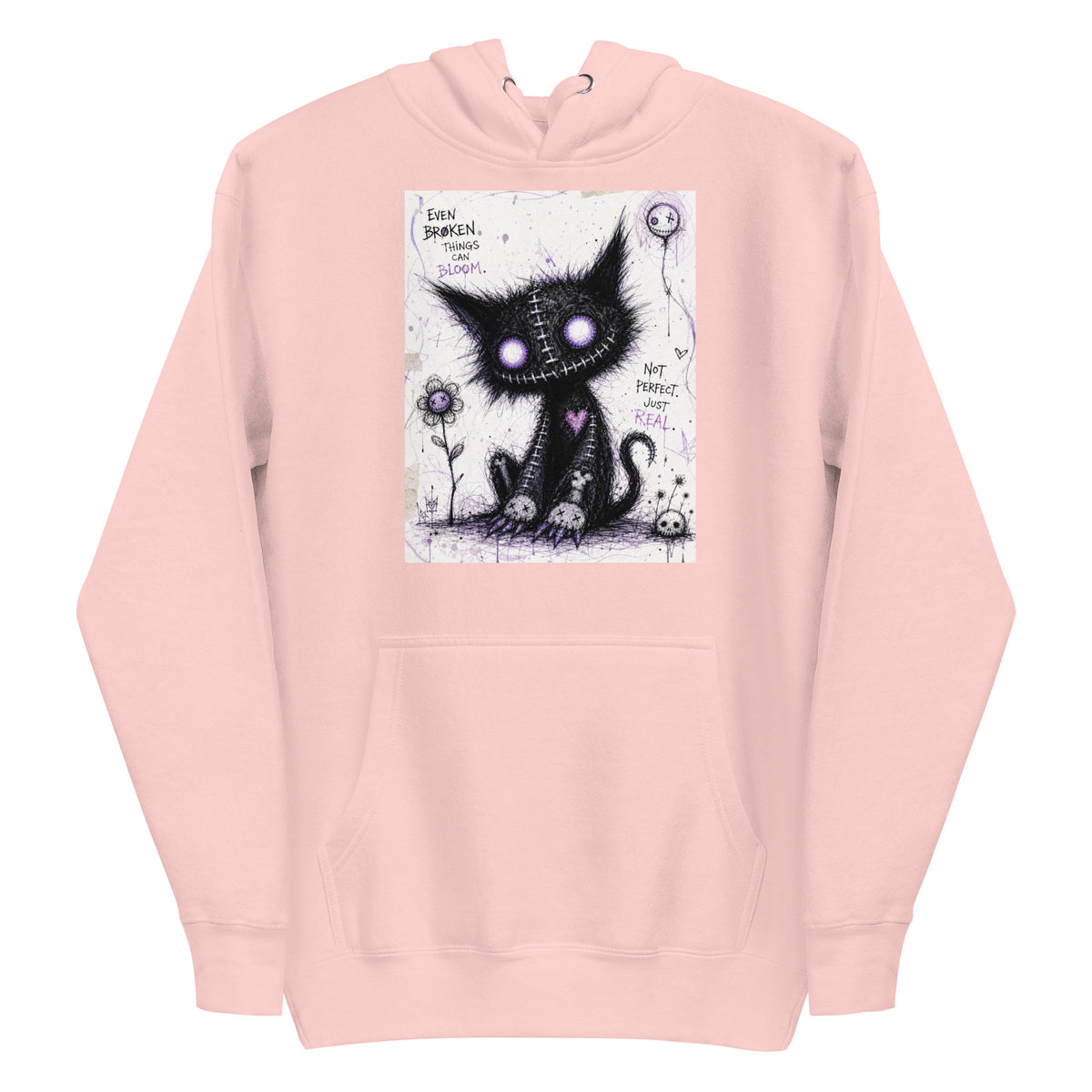 Light pink pullover hoodie with the 'Even Broken Things Can Bloom' goth graphic: a stitched black cat with glowing purple eyes beside a flower, with the words "Even broken things can bloom"