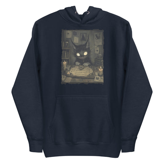 Navy pullover hoodie with the 'Free Readings' goth graphic: a wide-eyed black cat creature at a Ouija board surrounded by candles