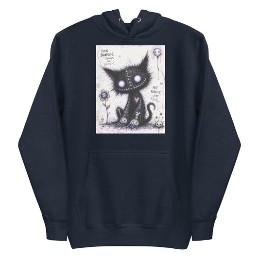 Navy pullover hoodie with the 'Even Broken Things Can Bloom' goth graphic: a stitched black cat with glowing purple eyes beside a flower, with the words "Even broken things can bloom"