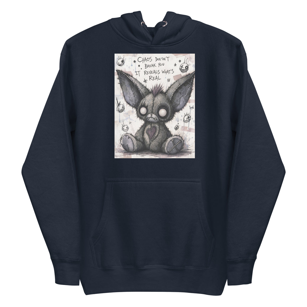 Navy pullover hoodie with the 'Chaos' goth graphic: a stitched gray big-eared creature with button eyes, with the words "Chaos doesn't break you, it reveals what's real"