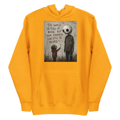 Gold pullover hoodie with the 'Stay Kind' goth graphic: a tall skull-faced figure and a small child holding a flower, with the words "The world is full of noise, but your kindness can still be heard"