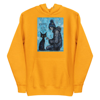 Gold pullover hoodie with the 'Kindness Is Never Wasted' goth graphic: a girl in a moon beanie petting a black cat on a blue background, with the words "Kindness is never wasted"