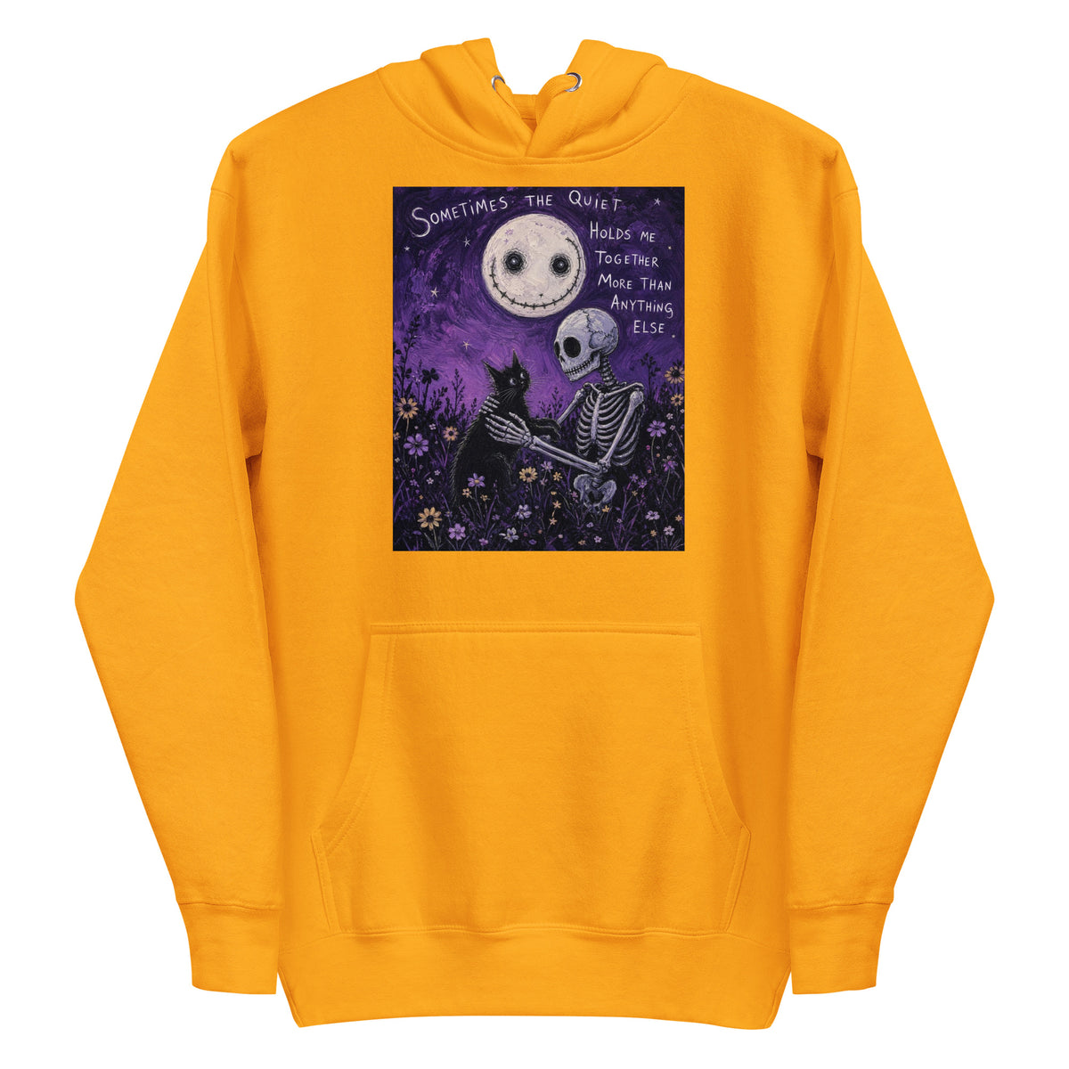 Gold pullover hoodie with the 'The Quiet Heals' goth graphic: a skeleton and a black cat in a purple flower field under a smiling moon, with the words "Sometimes the quiet holds me together more than anything else"