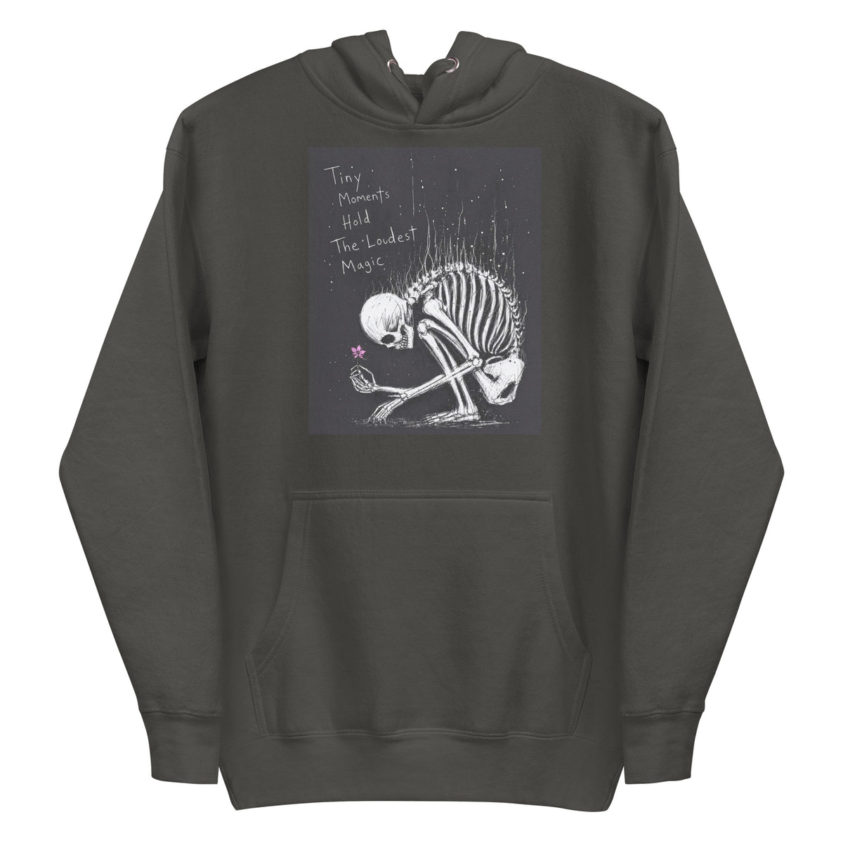 Vintage black pullover hoodie with the 'Tiny Moments' goth graphic: a kneeling skeleton holding a tiny pink flower on a black background, with the words "Tiny moments hold the loudest magic"
