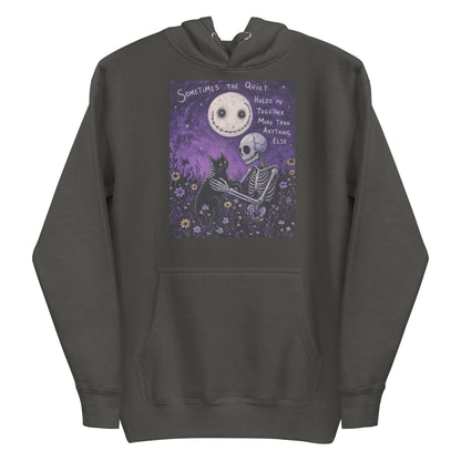 Vintage black pullover hoodie with the 'The Quiet Heals' goth graphic: a skeleton and a black cat in a purple flower field under a smiling moon, with the words "Sometimes the quiet holds me together more than anything else"