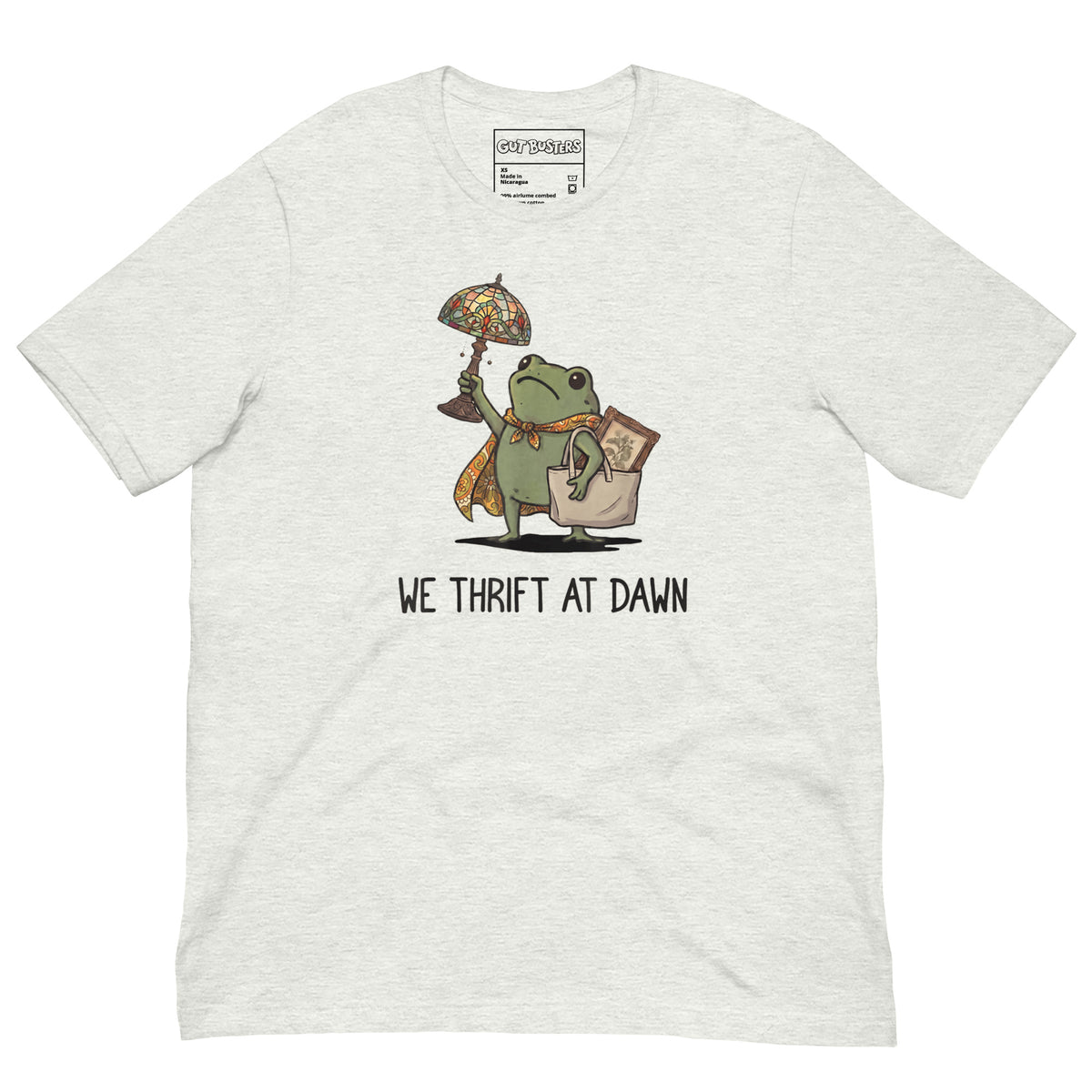 Funny "We Thrift At Dawn Frog" graphic printed on an ash unisex tee, front view
