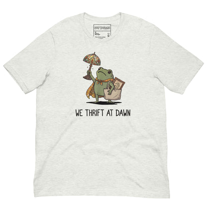 Funny "We Thrift At Dawn Frog" graphic printed on an ash unisex tee, front view