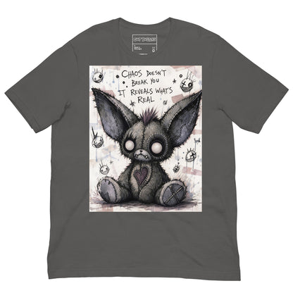 Asphalt unisex t-shirt with the 'Chaos' goth graphic: a stitched gray big-eared creature with button eyes, with the words "Chaos doesn't break you, it reveals what's real"