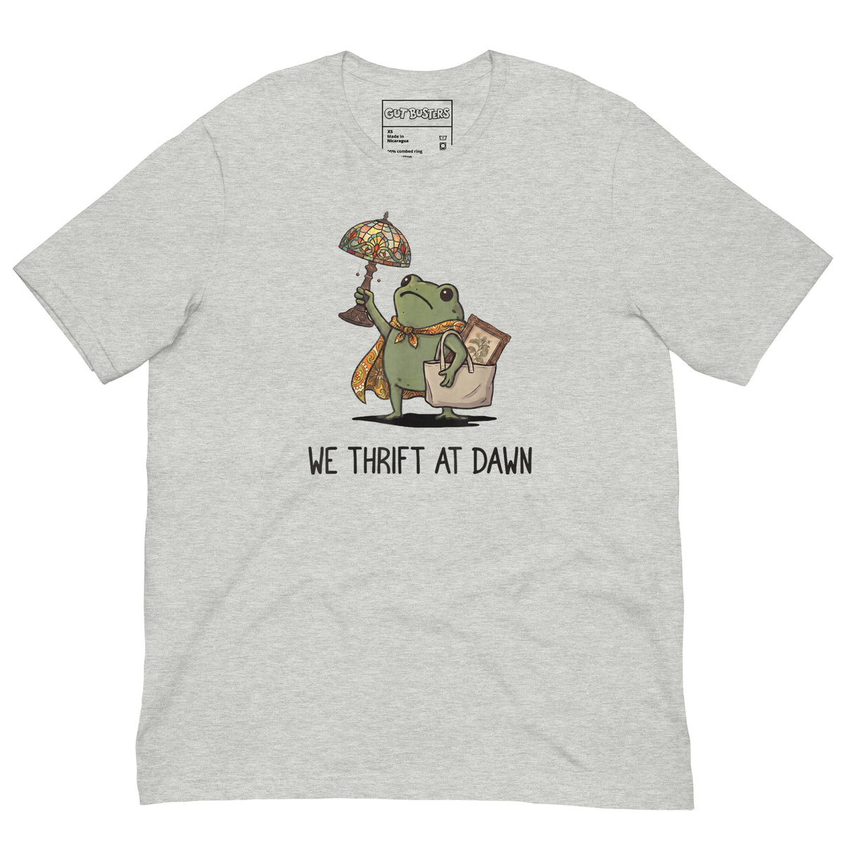 Funny "We Thrift At Dawn Frog" graphic printed on an athletic heather unisex tee, front view