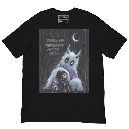 Black unisex t-shirt with the 'The Haunted' goth graphic: a little goth girl holding a candle beside a fuzzy blue monster under a crescent moon, with the words "Not everything that haunts you wants to hurt you"