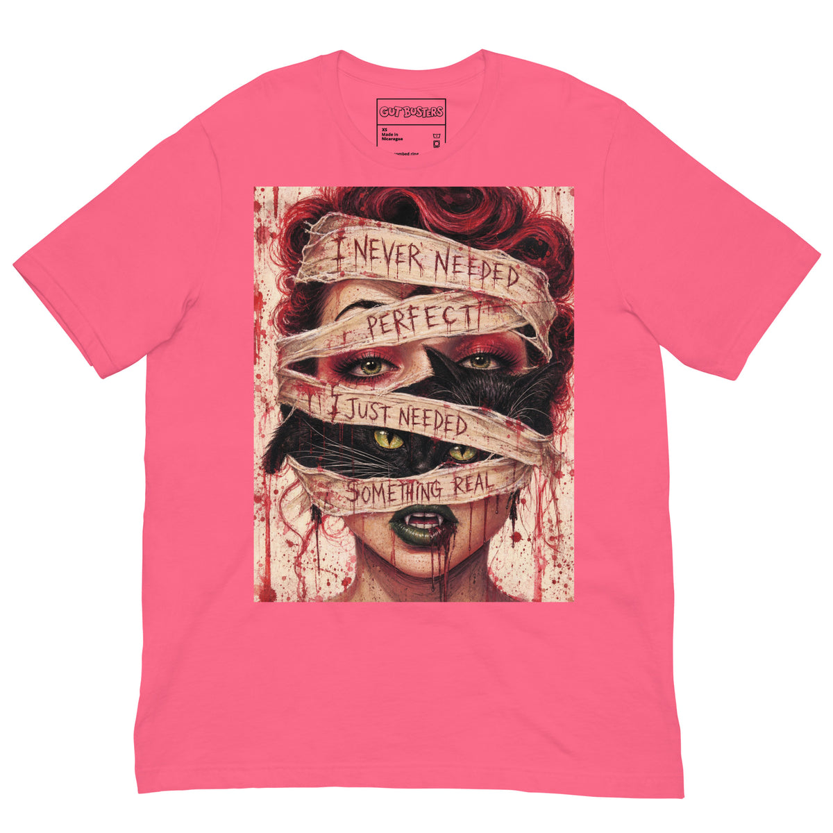 Pink unisex t-shirt with the 'Just Something Real' goth graphic: a red-haired woman's face wrapped in bandages, with the words "I never needed perfect, I just needed something real"