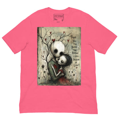 Pink unisex t-shirt with the 'My Light In Dark Places' goth graphic: a skull-faced couple embracing under a bare tree with red hearts, with the words "Thank you for being the reason I still believe in light"
