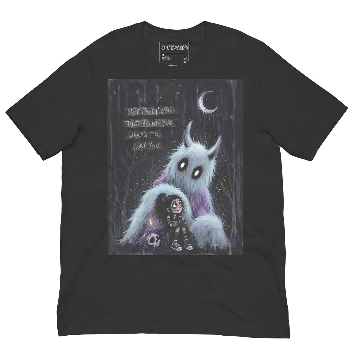 Dark grey unisex t-shirt with the 'The Haunted' goth graphic: a little goth girl holding a candle beside a fuzzy blue monster under a crescent moon, with the words "Not everything that haunts you wants to hurt you"
