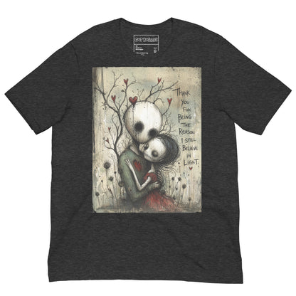 Dark grey heather unisex t-shirt with the 'My Light In Dark Places' goth graphic: a skull-faced couple embracing under a bare tree with red hearts, with the words "Thank you for being the reason I still believe in light"
