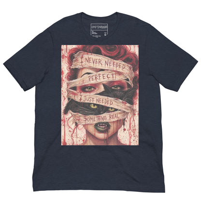 Heather navy unisex t-shirt with the 'Just Something Real' goth graphic: a red-haired woman's face wrapped in bandages, with the words "I never needed perfect, I just needed something real"