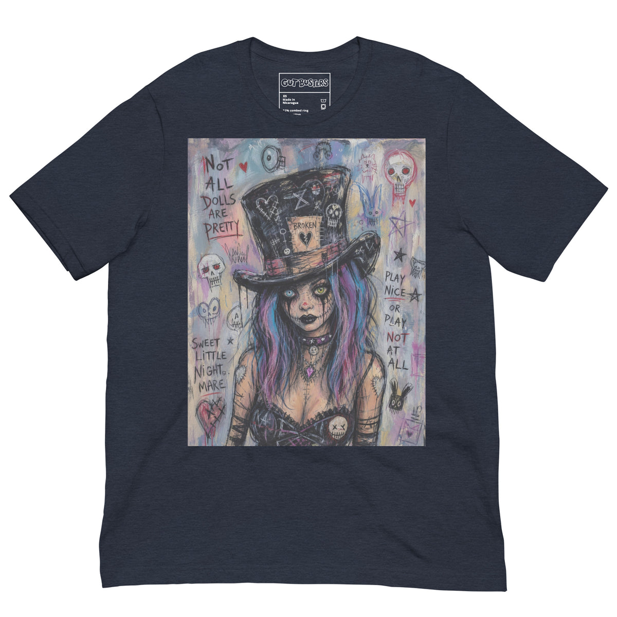 Heather navy unisex t-shirt with the 'The Real Alice' goth graphic: a goth girl with blue and purple hair in a patched top hat, with the words "Not all dolls are pretty"