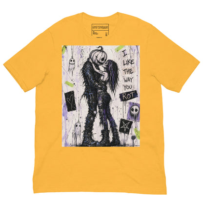 Heather yellow unisex t-shirt with the 'I Like The Way You Rot' goth graphic: a pumpkin-headed zombie kissing a purple-haired goth girl, with the words "I like the way you rot"