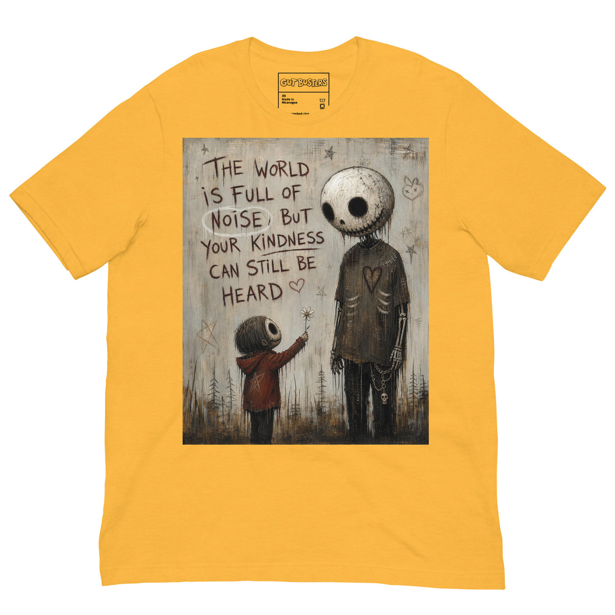 Heather yellow unisex t-shirt with the 'Stay Kind' goth graphic: a tall skull-faced figure and a small child holding a flower, with the words "The world is full of noise, but your kindness can still be heard"