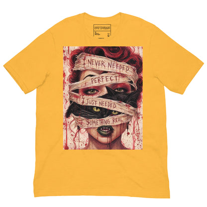 Heather yellow unisex t-shirt with the 'Just Something Real' goth graphic: a red-haired woman's face wrapped in bandages, with the words "I never needed perfect, I just needed something real"