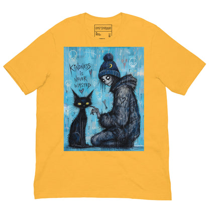 Heather yellow unisex t-shirt with the 'Kindness Is Never Wasted' goth graphic: a girl in a moon beanie petting a black cat on a blue background, with the words "Kindness is never wasted"
