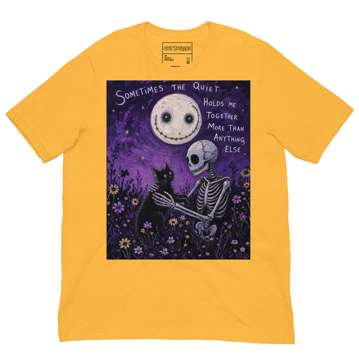 Heather yellow unisex t-shirt with the 'The Quiet Heals' goth graphic: a skeleton and a black cat in a purple flower field under a smiling moon, with the words "Sometimes the quiet holds me together more than anything else"