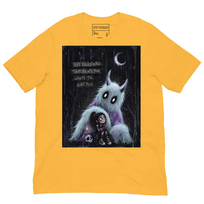 Heather yellow unisex t-shirt with the 'The Haunted' goth graphic: a little goth girl holding a candle beside a fuzzy blue monster under a crescent moon, with the words "Not everything that haunts you wants to hurt you"
