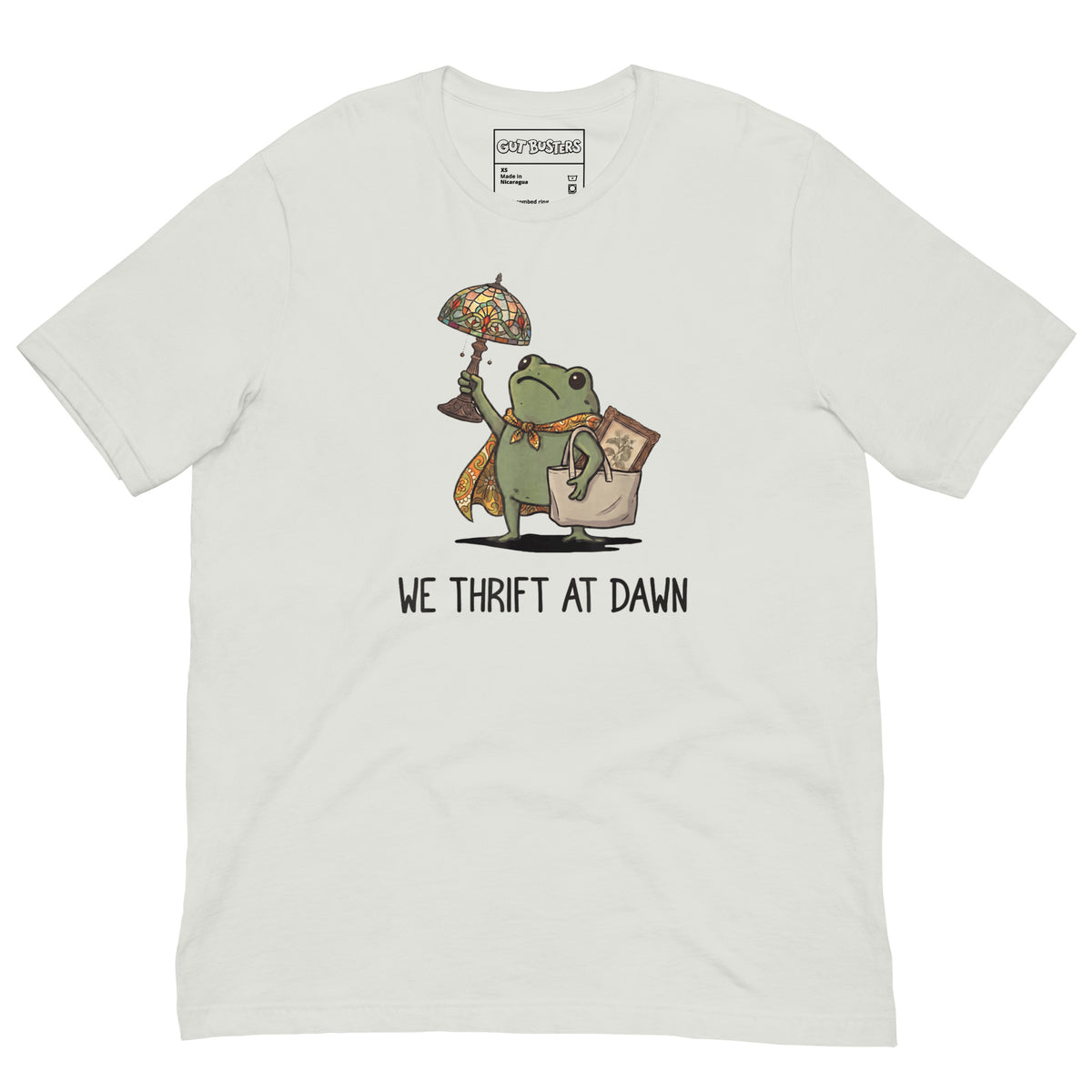 Funny "We Thrift At Dawn Frog" graphic printed on a silver unisex tee, front view
