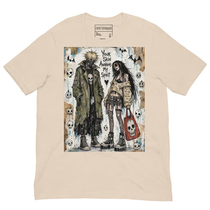 Soft cream unisex t-shirt with the 'Your Skin Awakens My Spirit' goth graphic: a grunge zombie couple standing together, with the words "Your skin awakens my spirit"
