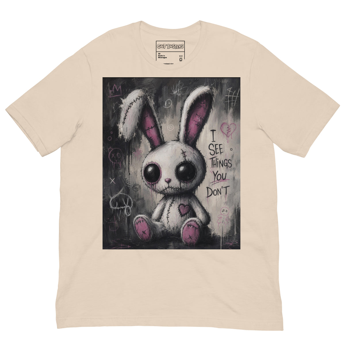 Soft cream unisex t-shirt with the 'I See Things You Don't' goth graphic: a stitched white bunny with hollow eyes, with the words "I see things you don't"