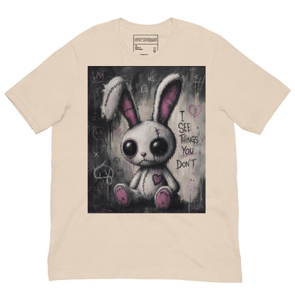 Soft cream unisex t-shirt with the 'I See Things You Don't' goth graphic: a stitched white bunny with hollow eyes, with the words "I see things you don't"
