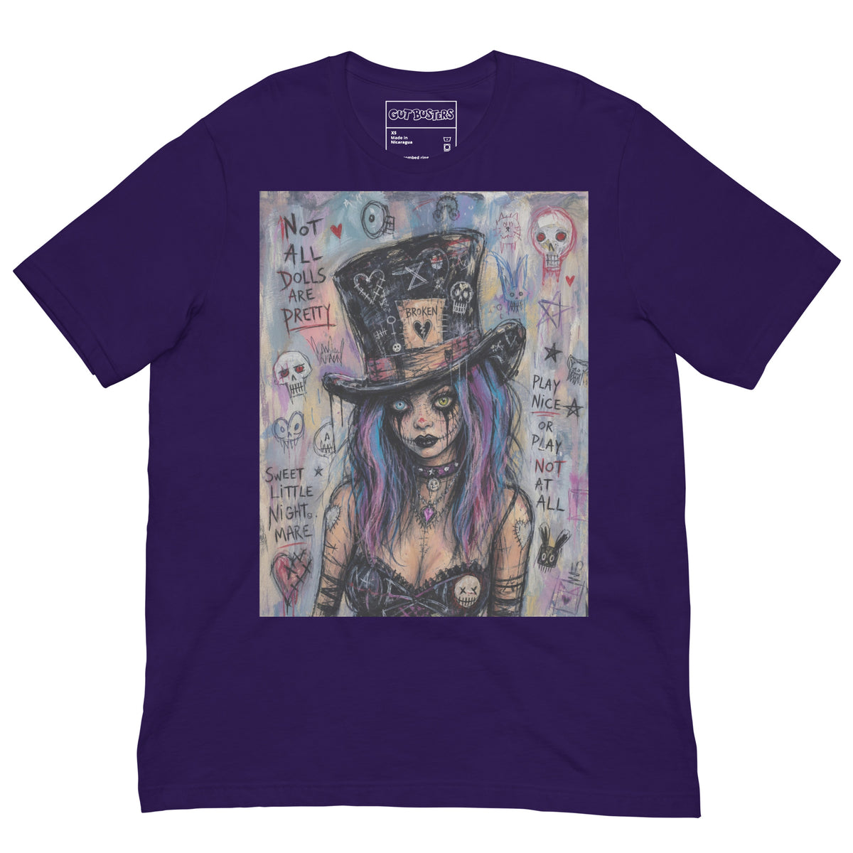 Purple unisex t-shirt with the 'The Real Alice' goth graphic: a goth girl with blue and purple hair in a patched top hat, with the words "Not all dolls are pretty"