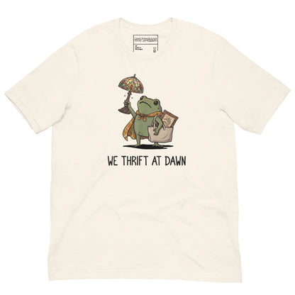 Funny "We Thrift At Dawn Frog" graphic printed on a vintage white unisex tee, front view