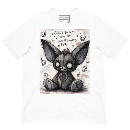White unisex t-shirt with the 'Chaos' goth graphic: a stitched gray big-eared creature with button eyes, with the words "Chaos doesn't break you, it reveals what's real"