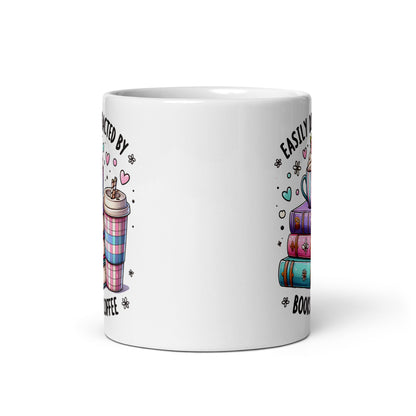 White glossy mug back view with partial “Easily distracted by” and cup graphic