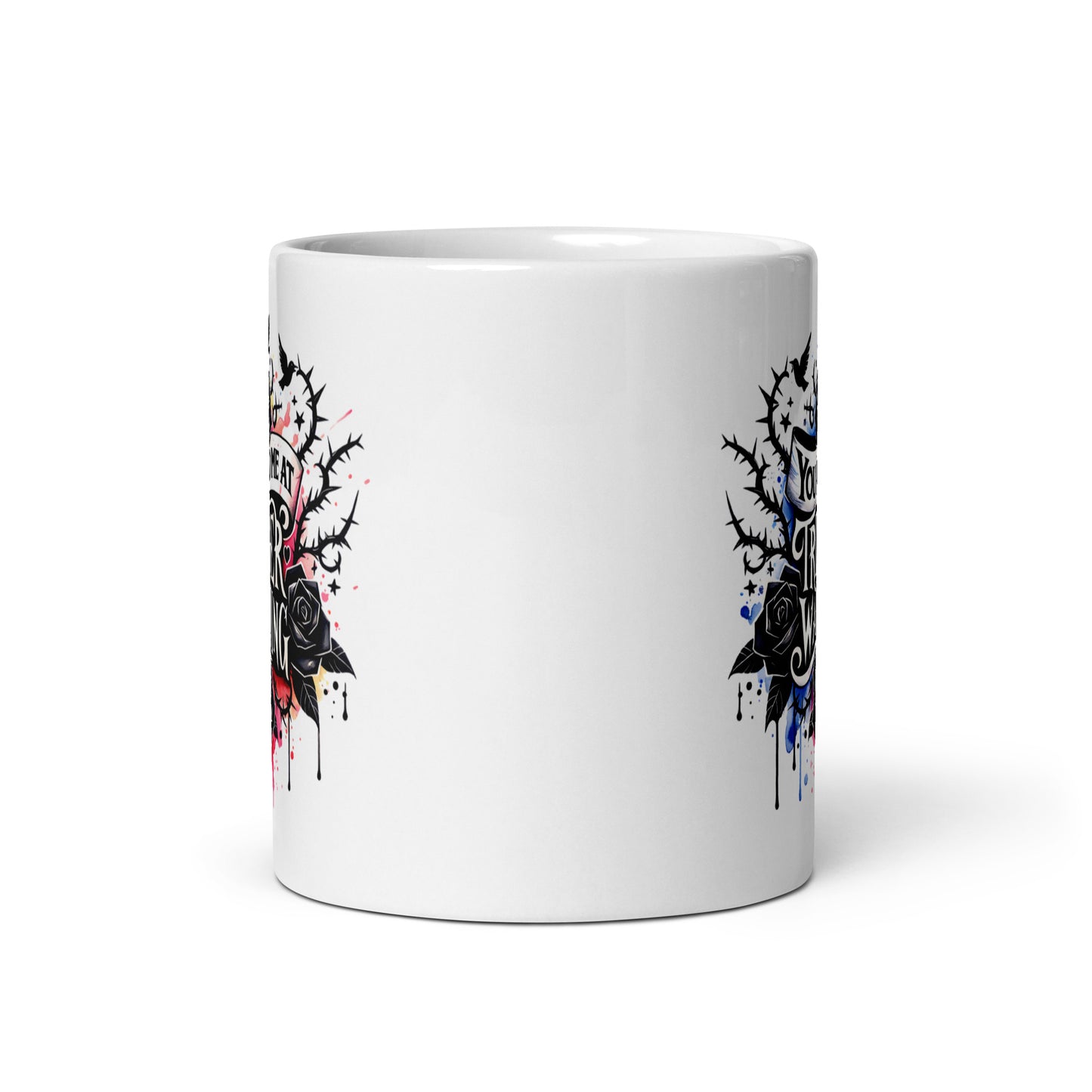 White glossy mug showing partial edge artwork on the reverse side