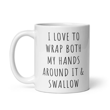 White glossy ceramic mug with black quote on front: I LOVE TO WRAP BOTH MY HANDS