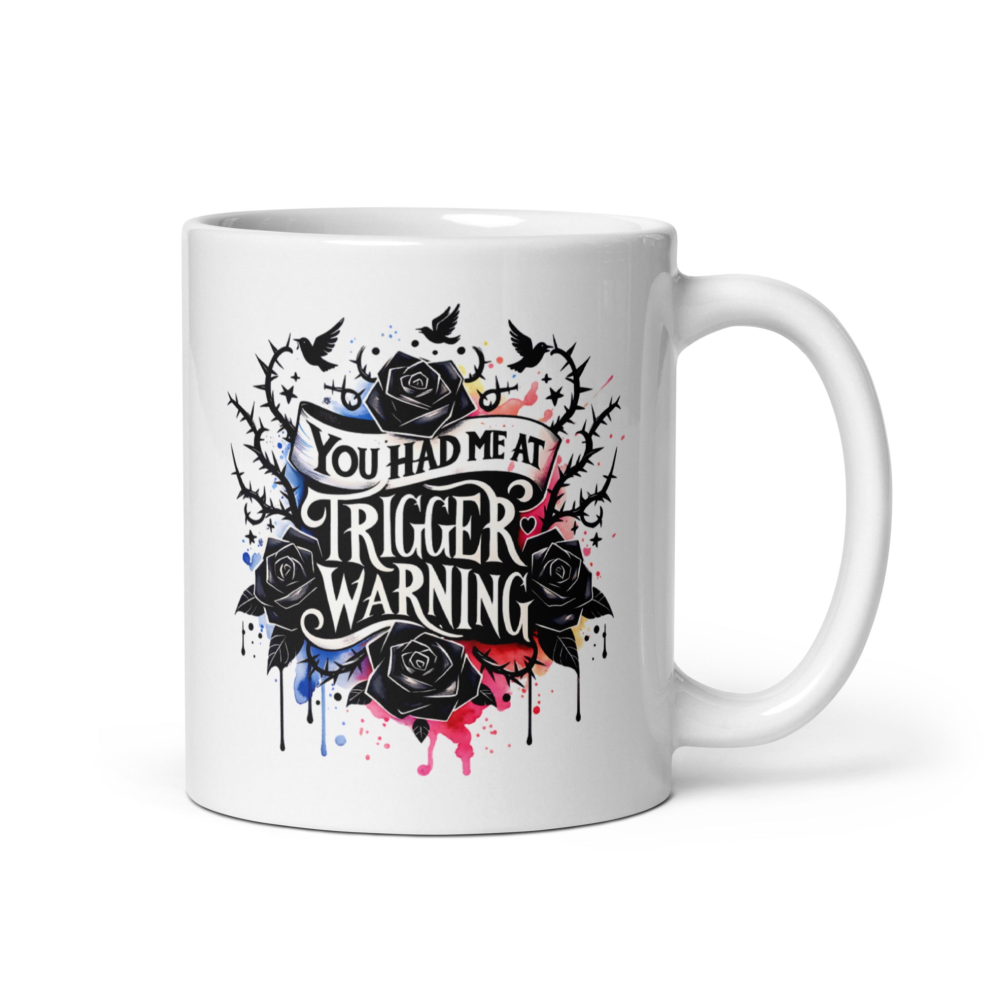 White glossy mug with centered 'Trigger warning' graphic and black rose artwork