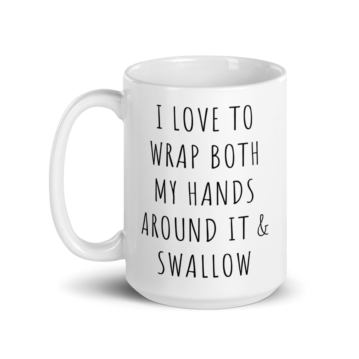 White glossy ceramic mug angled view with black quote: I LOVE TO WRAP BOTH MY HANDS