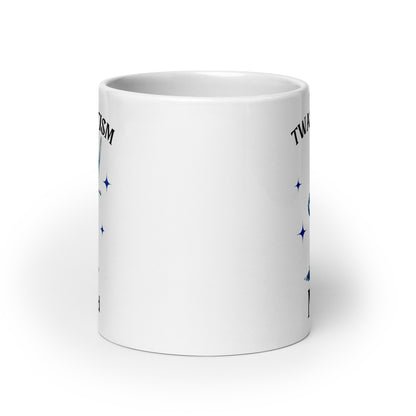 White glossy mug back with partial blue stars and 'Twas the Tism' text