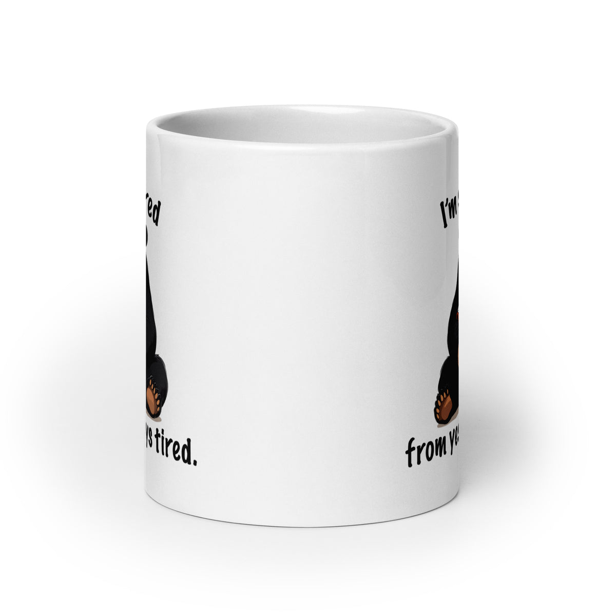 White mug back view with partial “I'm still tired” text and bear paws